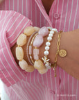 Armbandenset met roze blouse